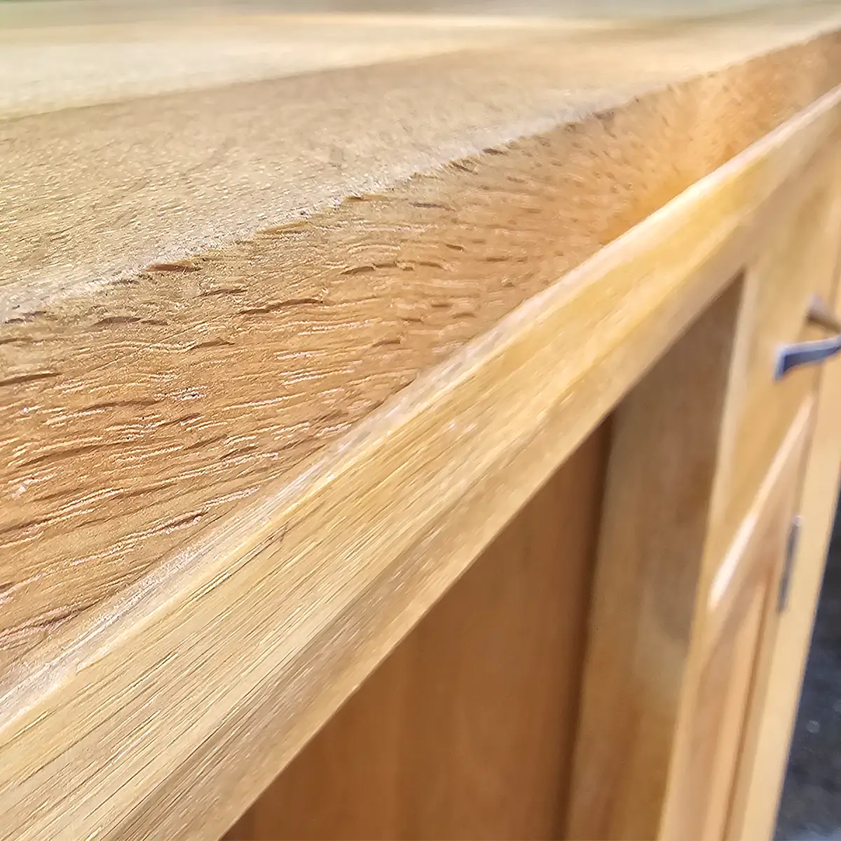 Wood grain detail of restored ash desk top